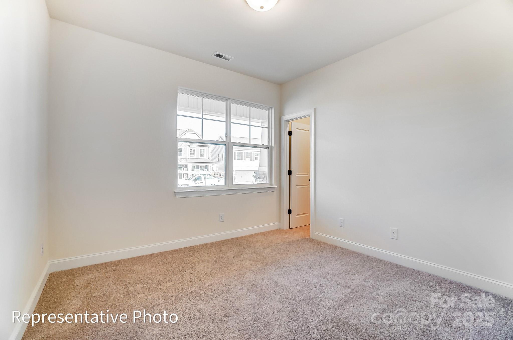 5009 Raging Crk Drive Indian Trail, NC 28079 - Photo 18 of 28 an empty room with windows
