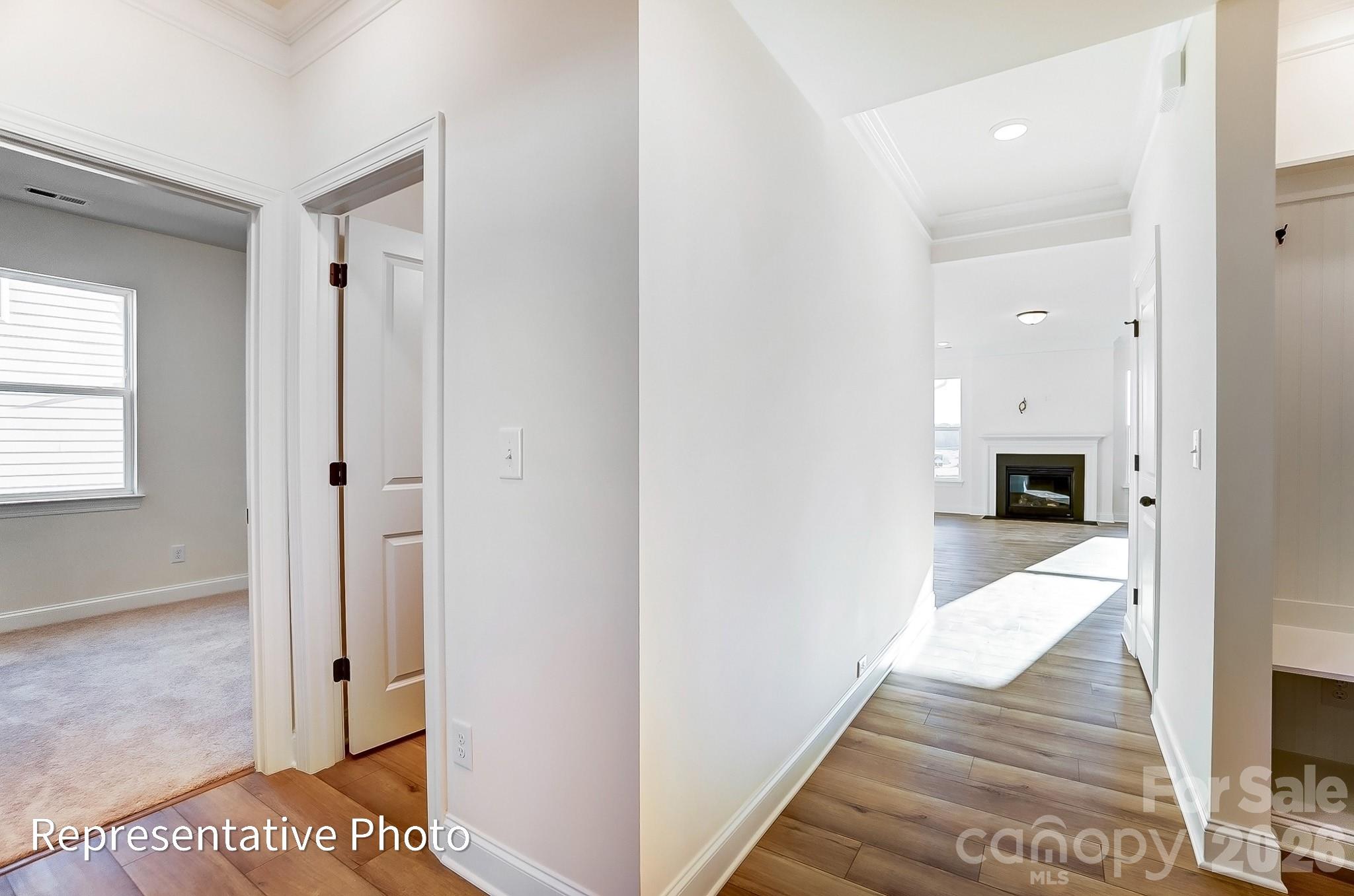 5009 Raging Crk Drive Indian Trail, NC 28079 - Photo 2 of 39 a view of a hallway view with wooden floor and a living room