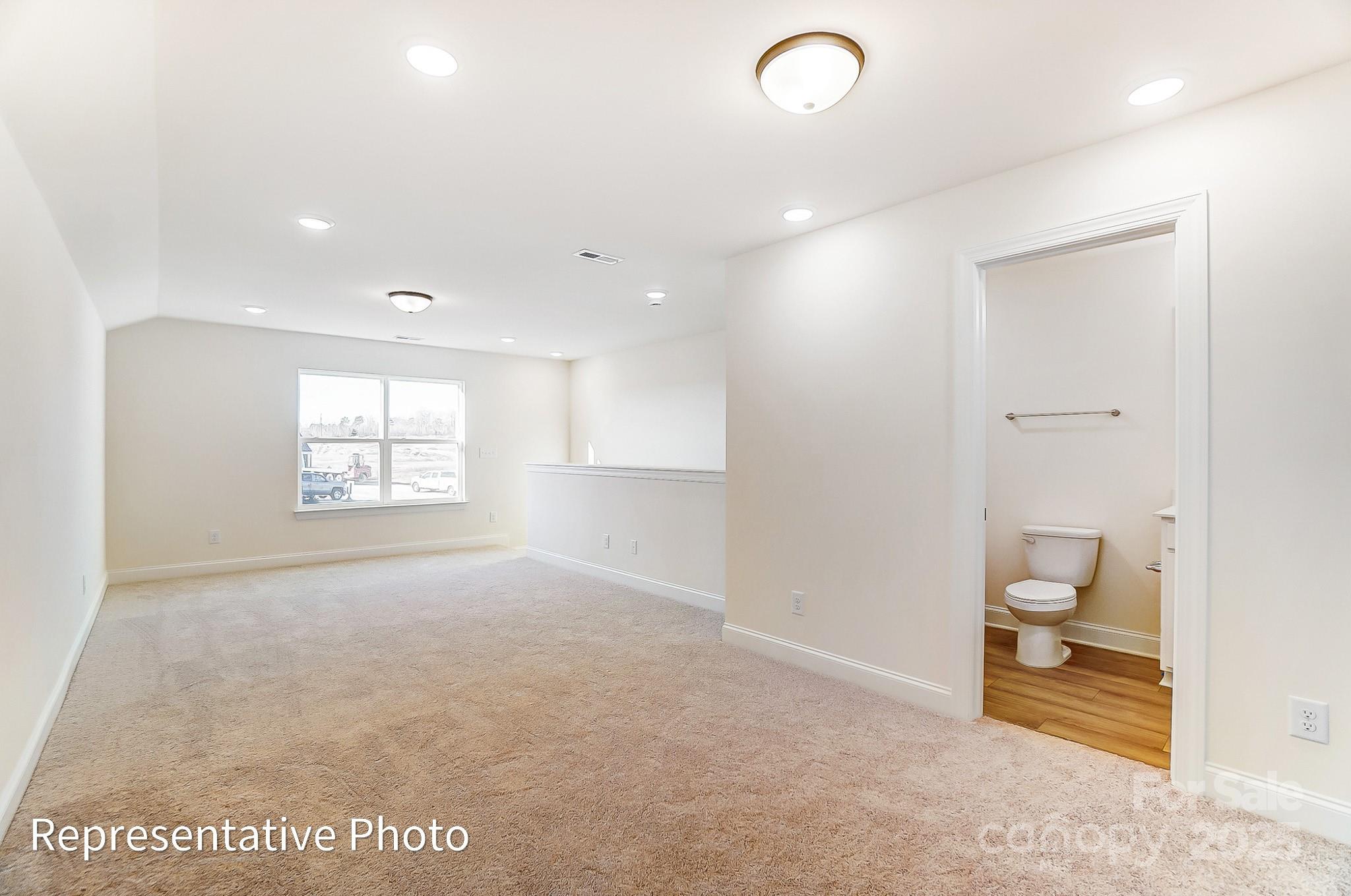 5009 Raging Crk Drive Indian Trail, NC 28079 - Photo 22 of 28 a view of a hallway with bathroom and a sink