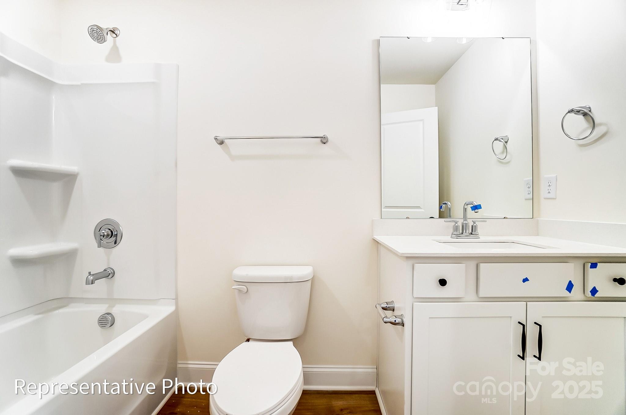 5009 Raging Crk Drive Indian Trail, NC 28079 - Photo 23 of 28 a bathroom with a sink a toilet and bathtub