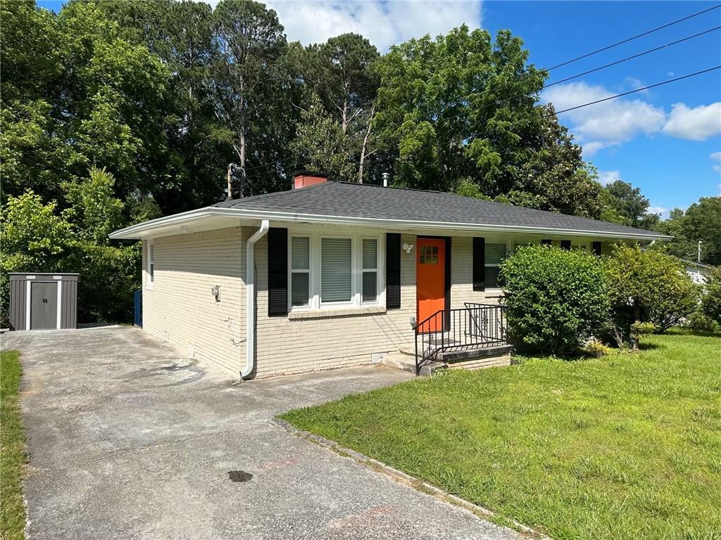 3593 Adkins Road Northwest Atlanta, GA 30331 - Photo 11 of 15 a house with green field in front of it