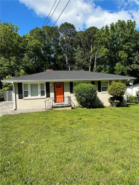 3593 Adkins Road Northwest Atlanta, GA 30331 - Photo 12 of 15 a front view of a house with a garden