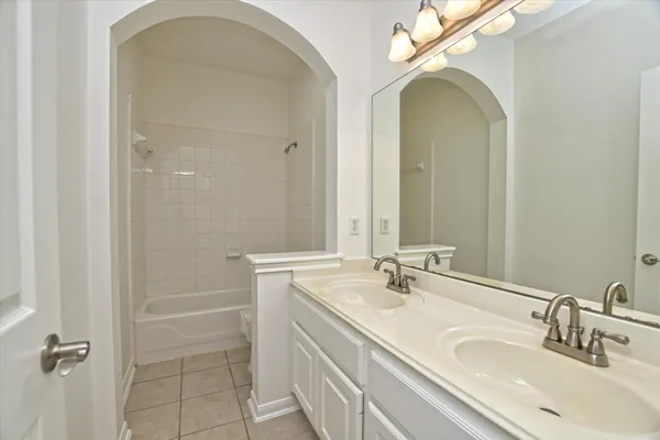 a bathroom with a sink a vanity and a mirror