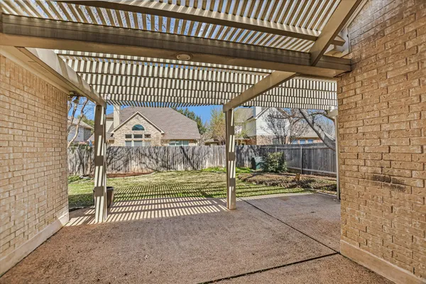 a view of a porch with a wooden fence