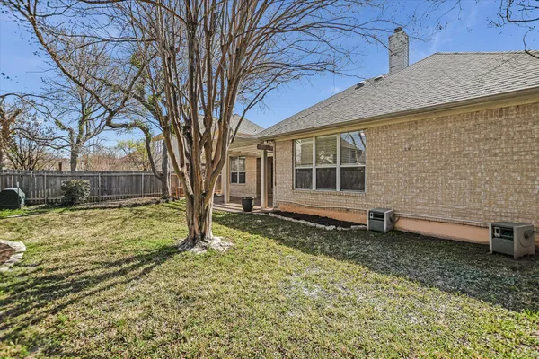 a house with trees in the background
