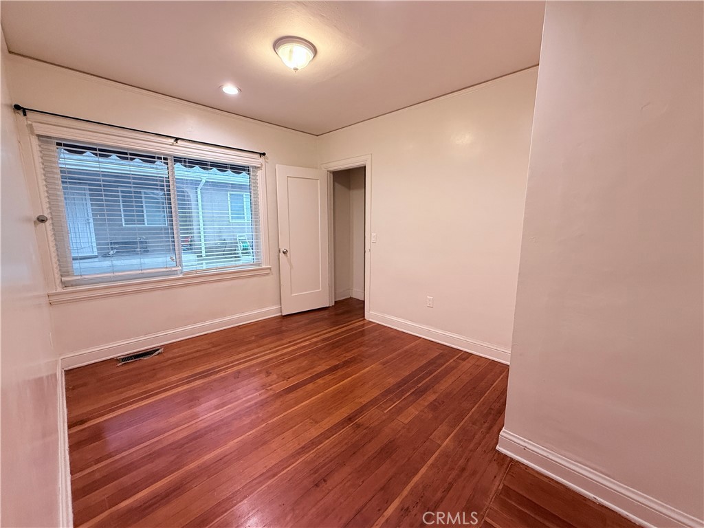 1837 South 7th Street Alhambra, CA 91803 - Photo 14 of 17 an empty room with wooden floor and windows
