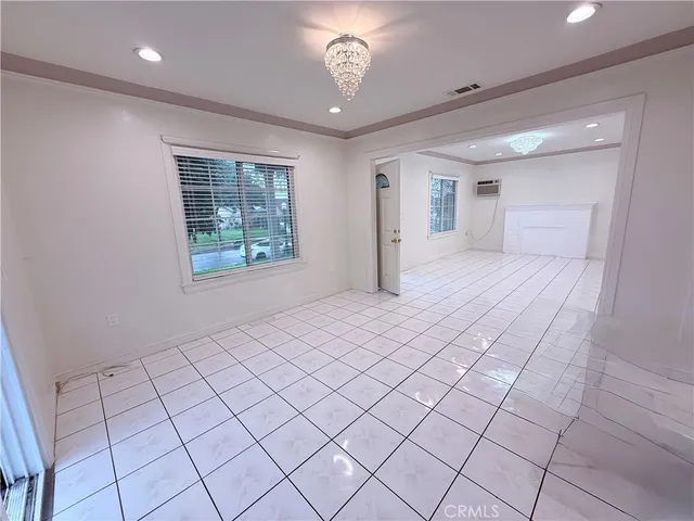 a view of an empty room and window