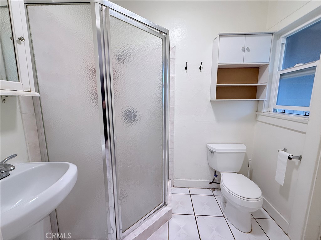 1837 South 7th Street Alhambra, CA 91803 - Photo 9 of 17 a bathroom with a toilet a sink and a shower