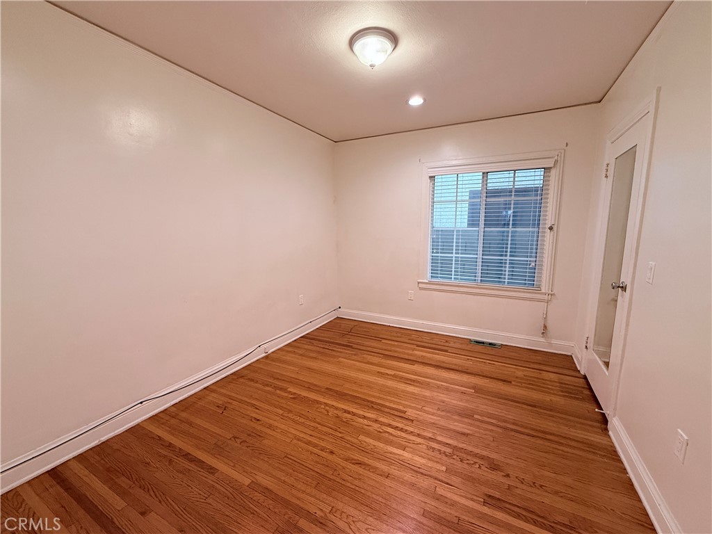 1837 South 7th Street Alhambra, CA 91803 - Photo 10 of 17 an empty room with wooden floor and windows