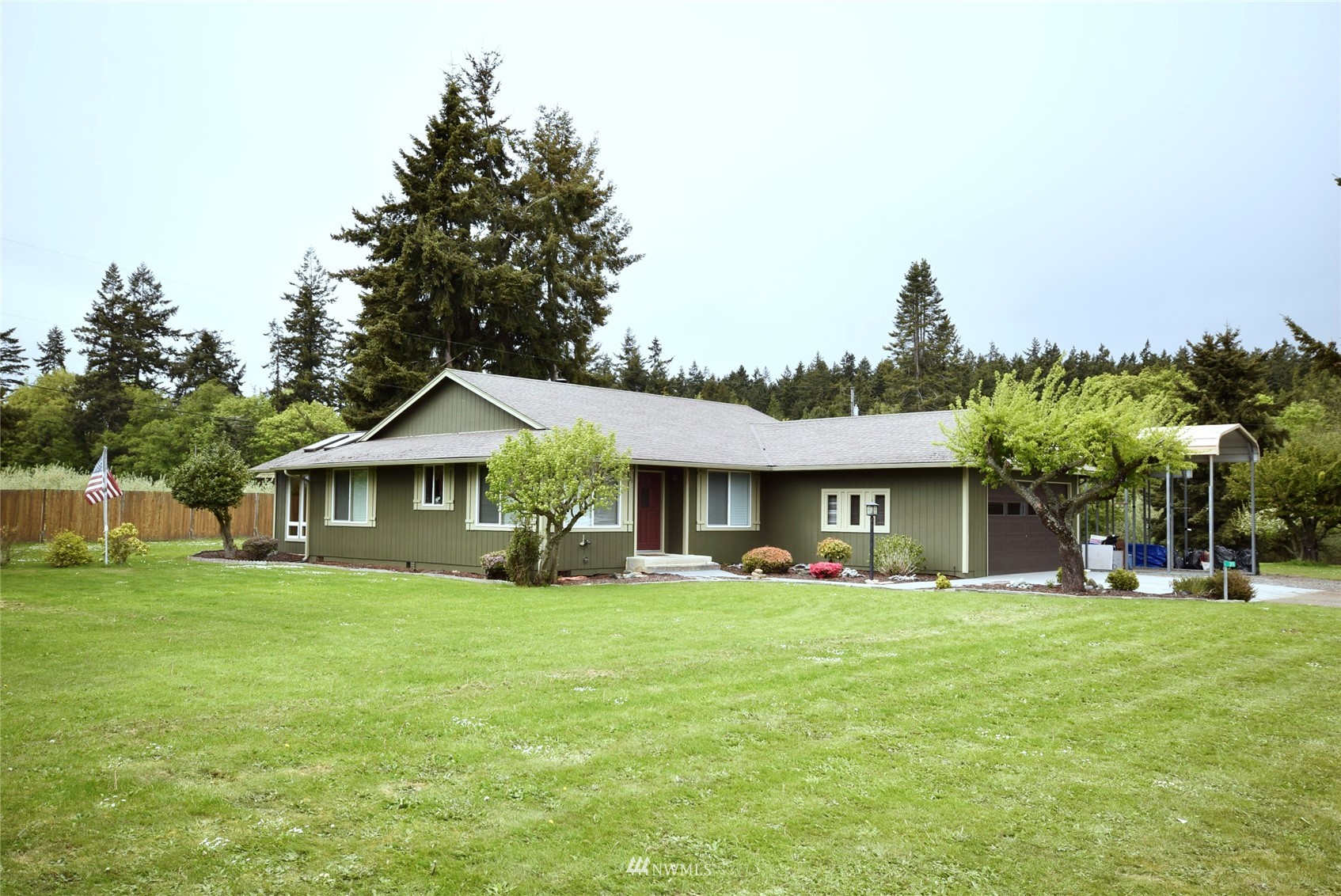 a front view of house with yard and green space