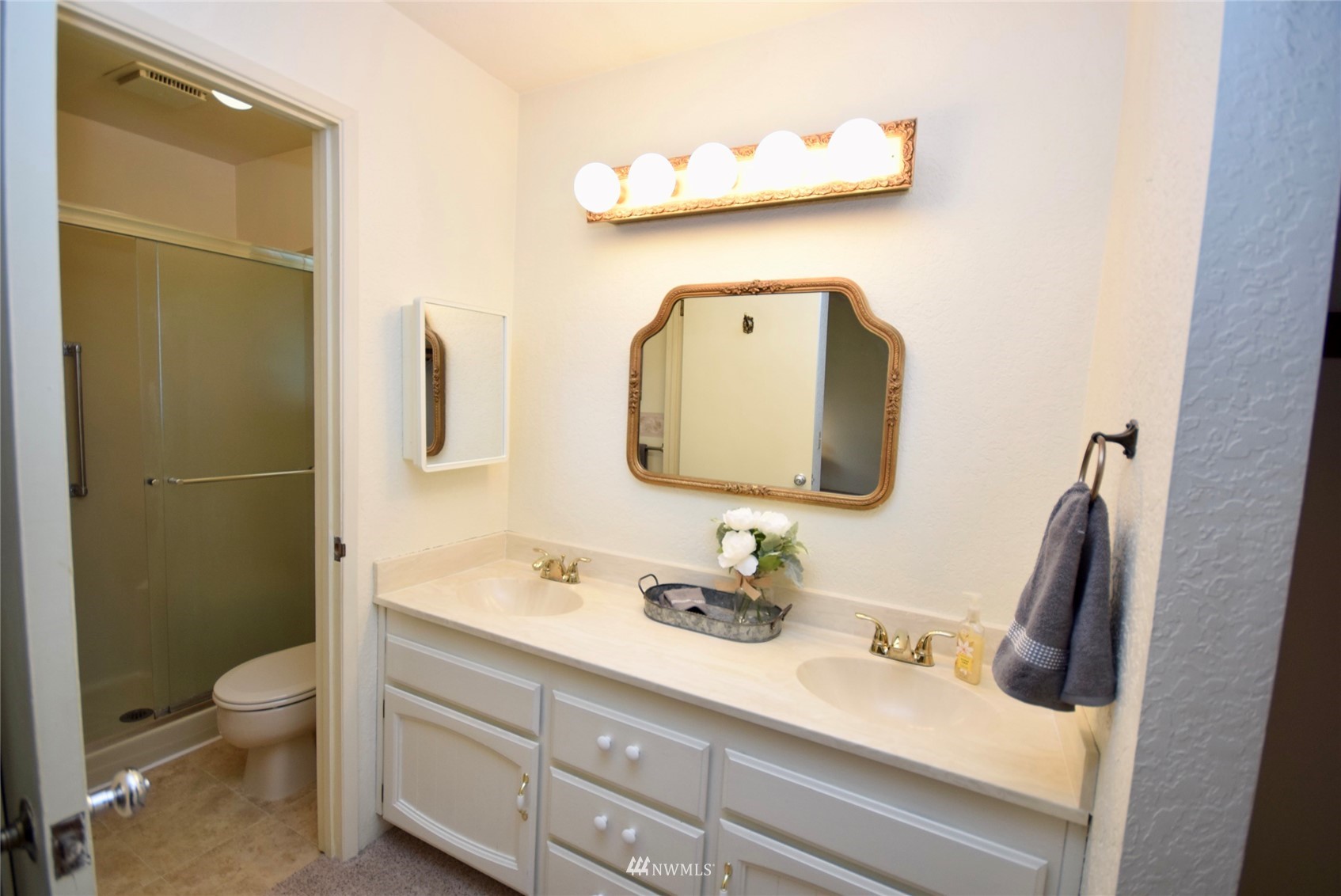 21 Clary Lane Sequim, WA 98382 - Photo 19 of 29 a bathroom with a toilet sink vanity tub and mirror