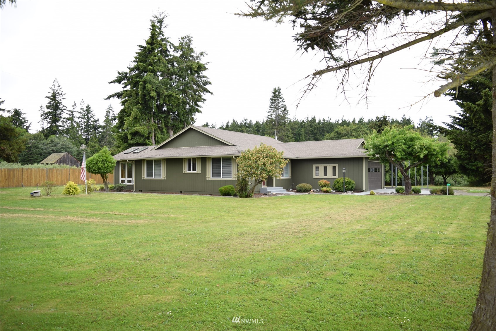 21 Clary Lane Sequim, WA 98382 - Photo 25 of 29 a front view of a house with a garden