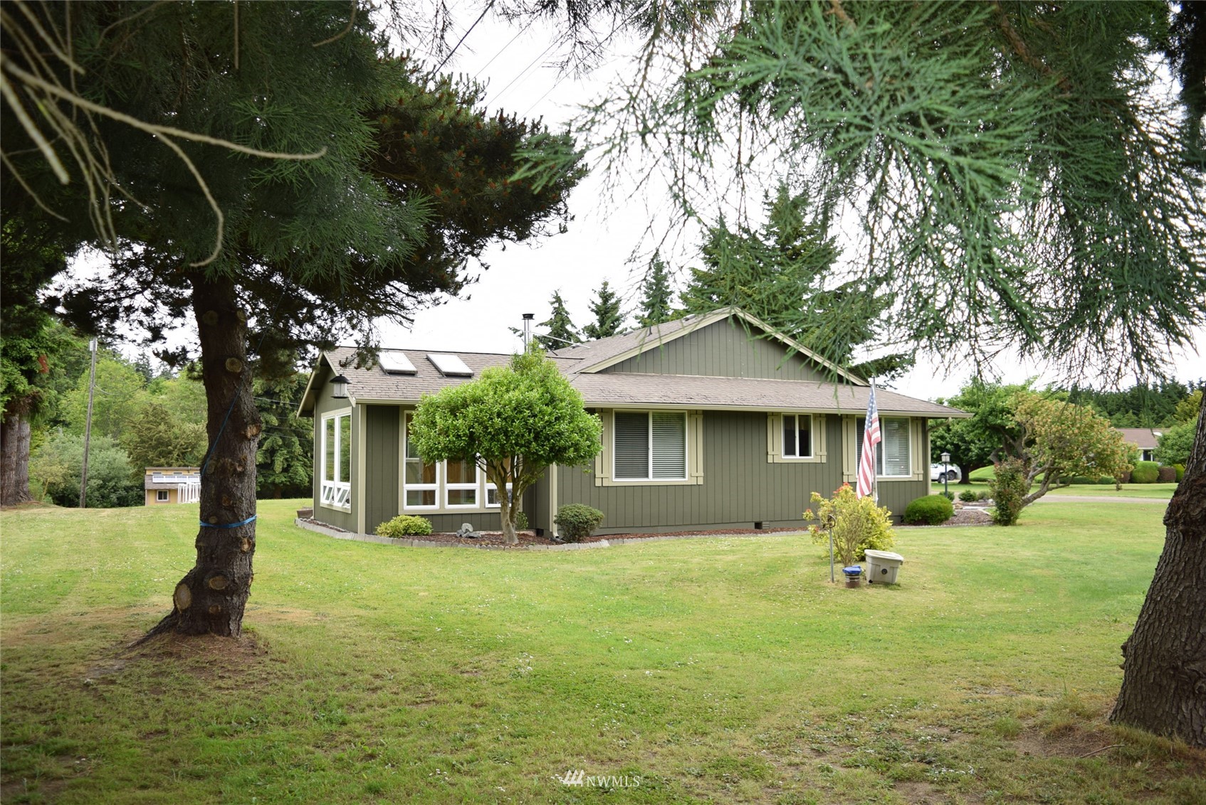 21 Clary Lane Sequim, WA 98382 - Photo 5 of 29 a front view of a house with garden