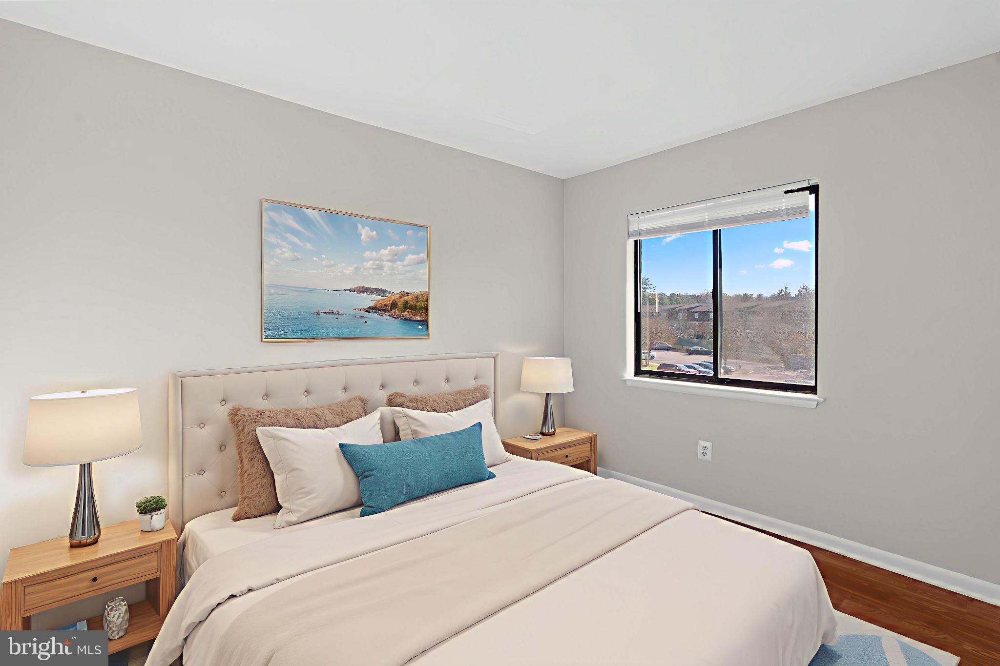 7616 Savannah Street, Unit 201 Falls Church, VA 22043 - Photo 11 of 29 a bedroom with a bed and a painting on the wall