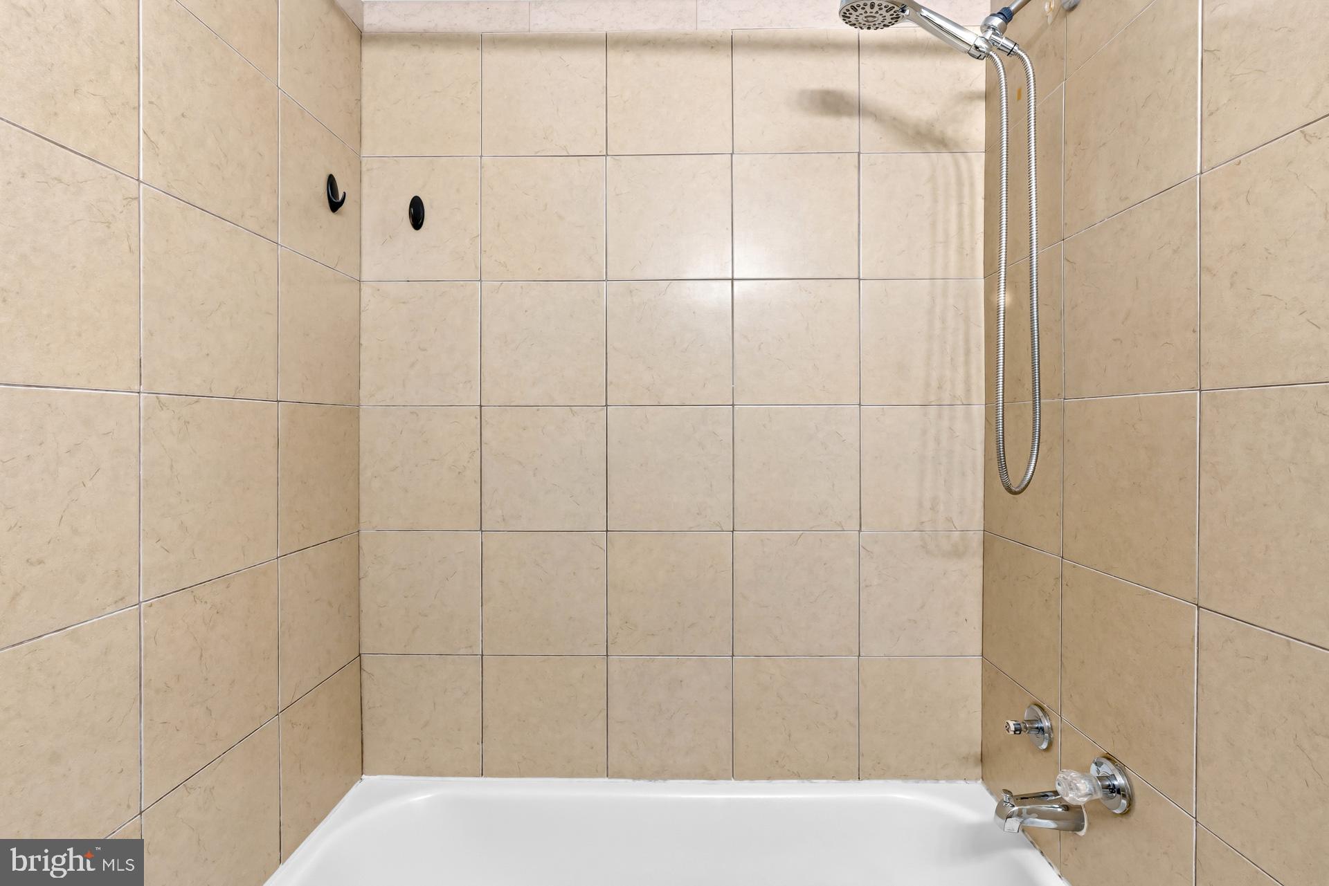 7616 Savannah Street, Unit 201 Falls Church, VA 22043 - Photo 16 of 29 a bathroom with a bathtub