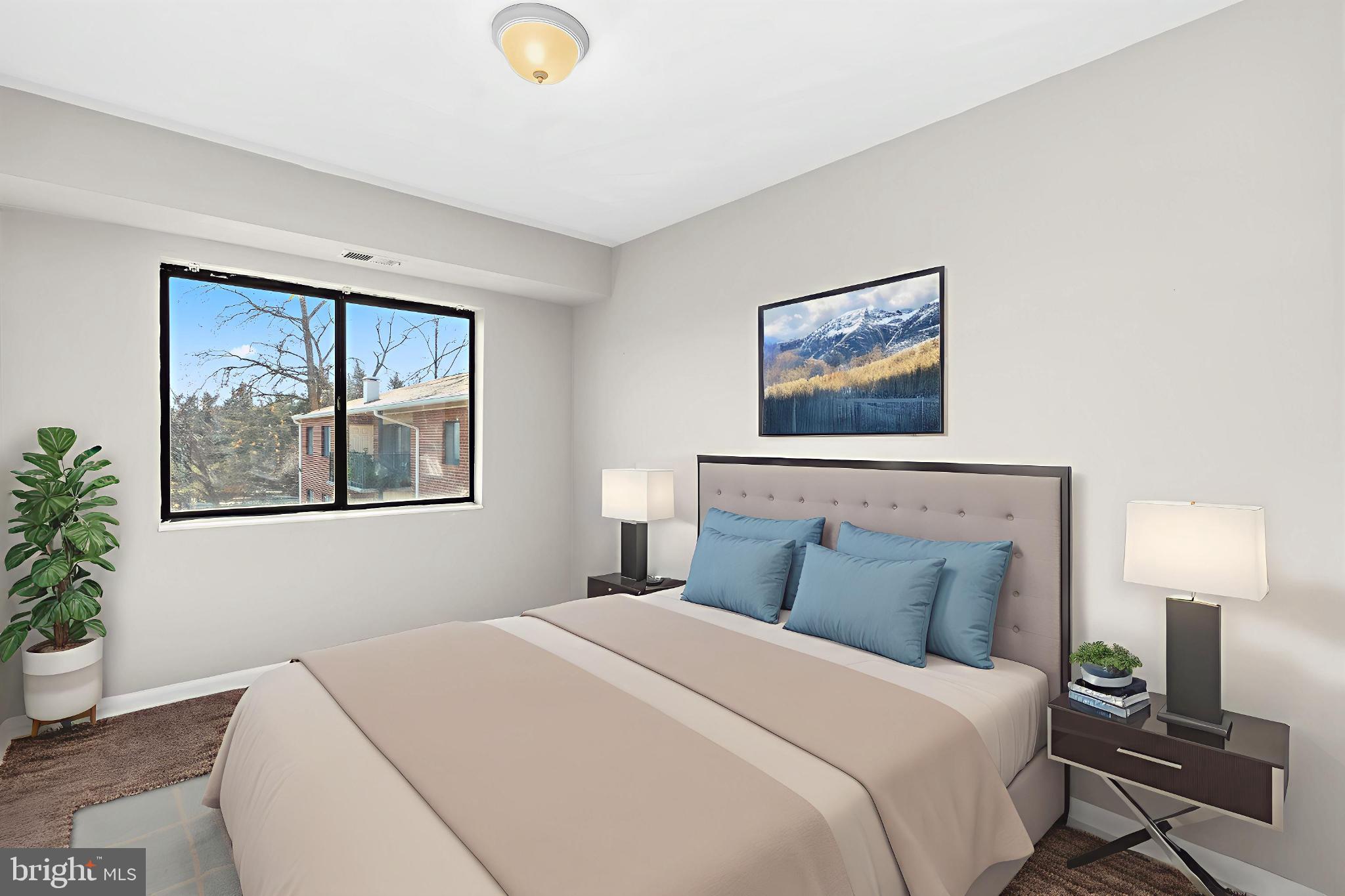 7616 Savannah Street, Unit 201 Falls Church, VA 22043 - Photo 18 of 29 a bedroom with a bed and a painting on the wall