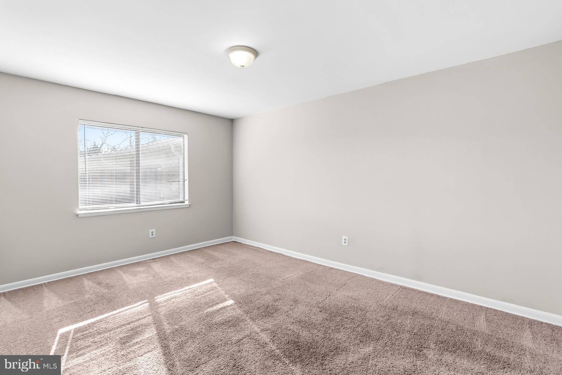 7616 Savannah Street, Unit 201 Falls Church, VA 22043 - Photo 20 of 29 an empty room with windows