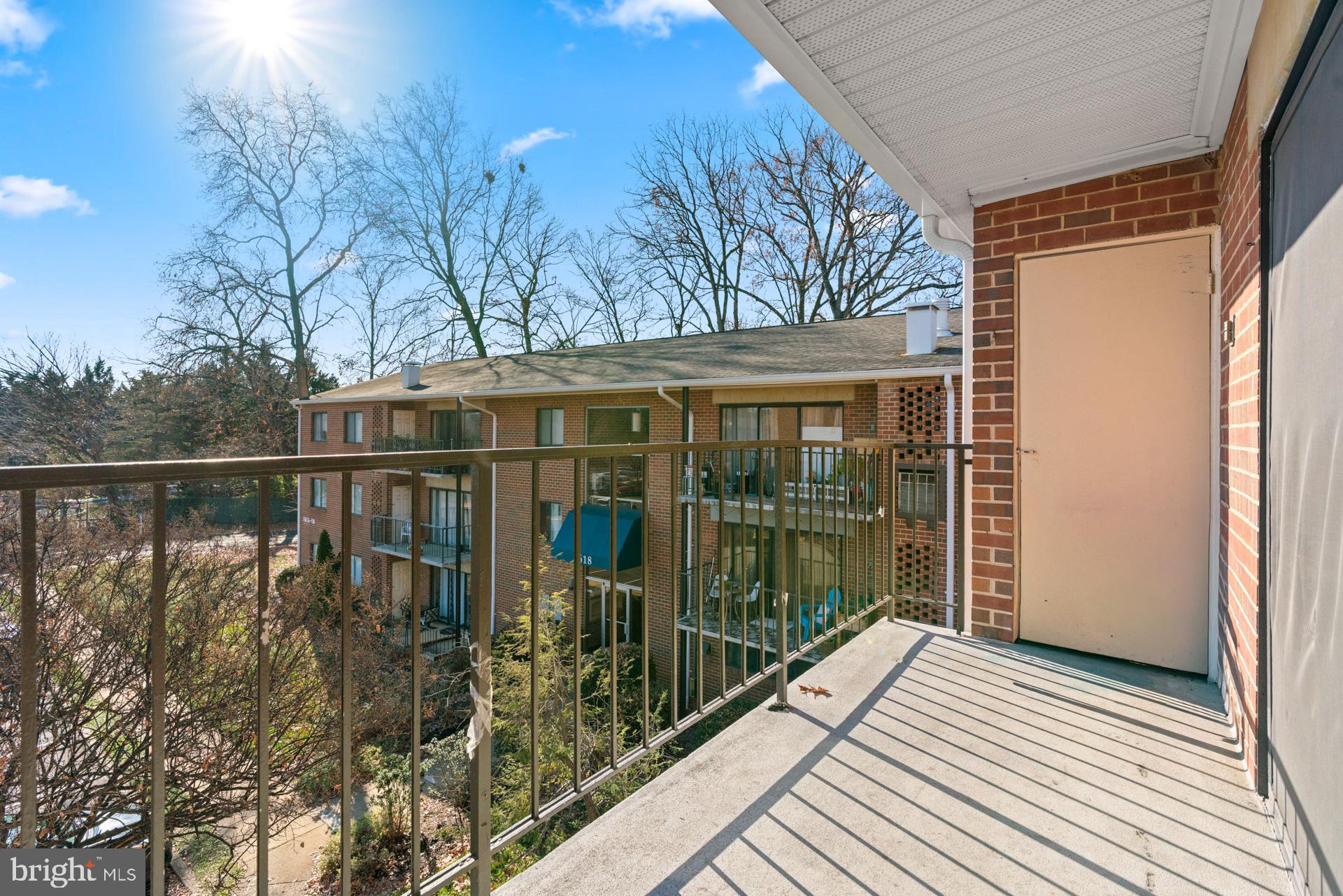 7616 Savannah Street, Unit 201 Falls Church, VA 22043 - Photo 28 of 29 a view of a house with a balcony