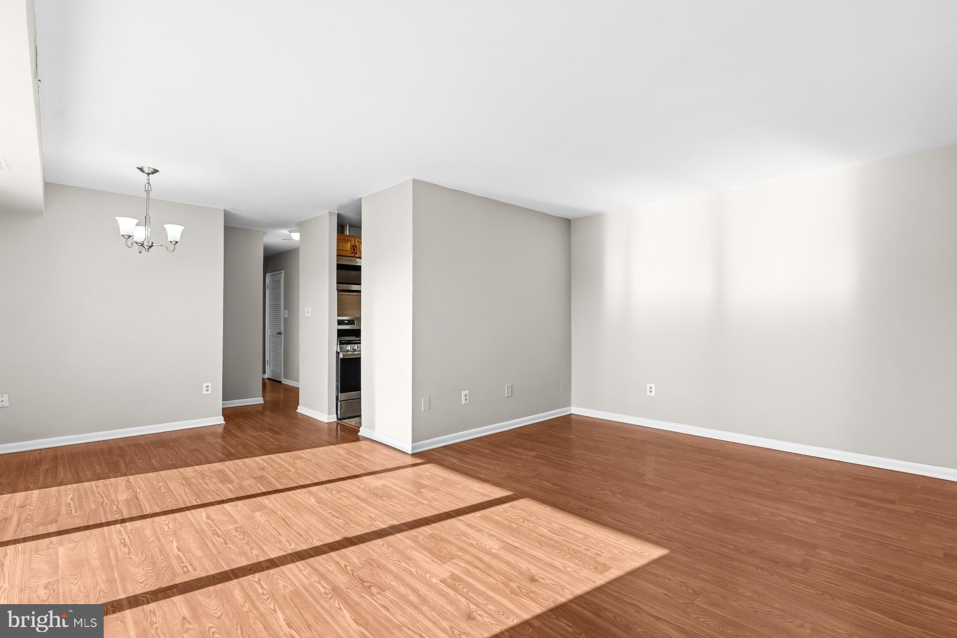 7616 Savannah Street, Unit 201 Falls Church, VA 22043 - Photo 6 of 29 a view of an empty room with wooden floor