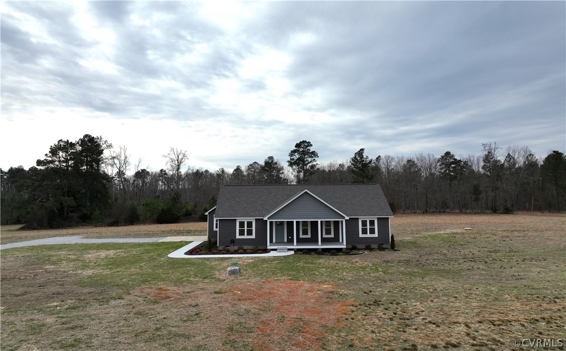 206 Wilson Road Blackstone, VA 23824 - Photo 1 of 38 a view of a house with a big yard next to a yard