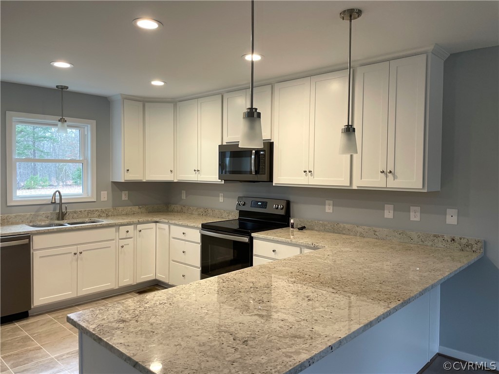 206 Wilson Road Blackstone, VA 23824 - Photo 13 of 38 a kitchen with granite countertop a sink a counter top space appliances and cabinets