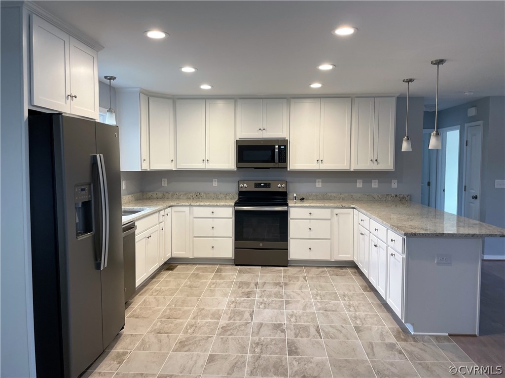206 Wilson Road Blackstone, VA 23824 - Photo 14 of 38 a kitchen with granite countertop a refrigerator and a stove