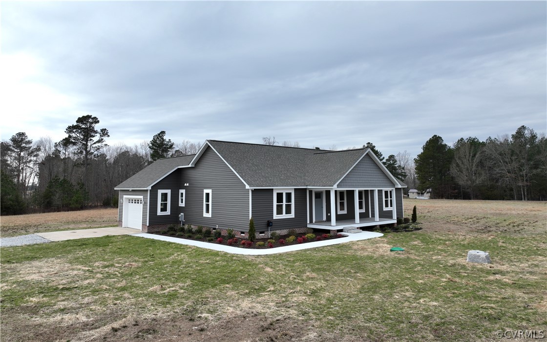 206 Wilson Road Blackstone, VA 23824 - Photo 3 of 38 a front view of a house with a garden