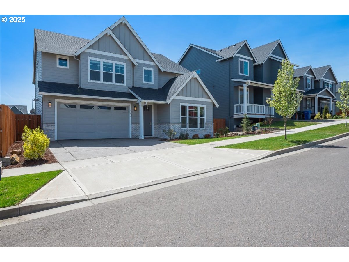 2754 Inna Avenue Northwest Salem, OR 97304 - Photo 1 of 34 a front view of a house with a yard and garage