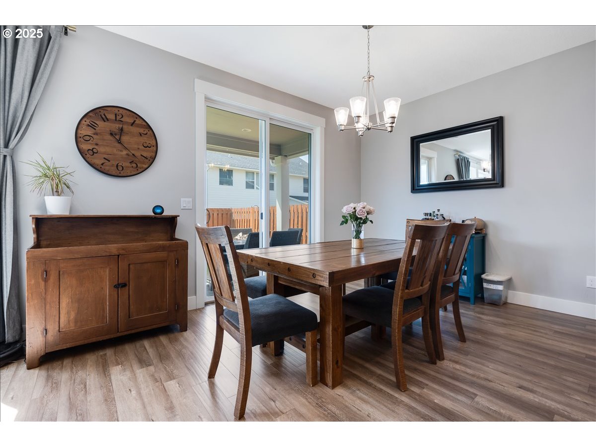 2754 Inna Avenue Northwest Salem, OR 97304 - Photo 8 of 34 a view of a dining room with furniture and chandelier