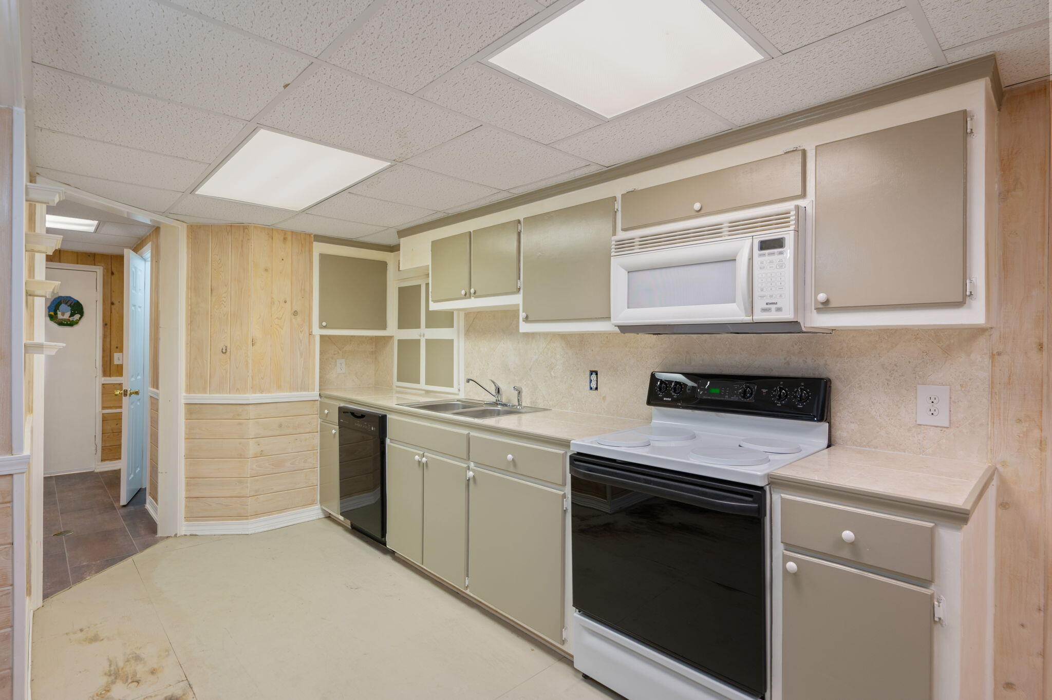 5644 Old Bethel Road Crestview, FL 32536 - Photo 39 of 55 a kitchen with a sink stove and cabinets