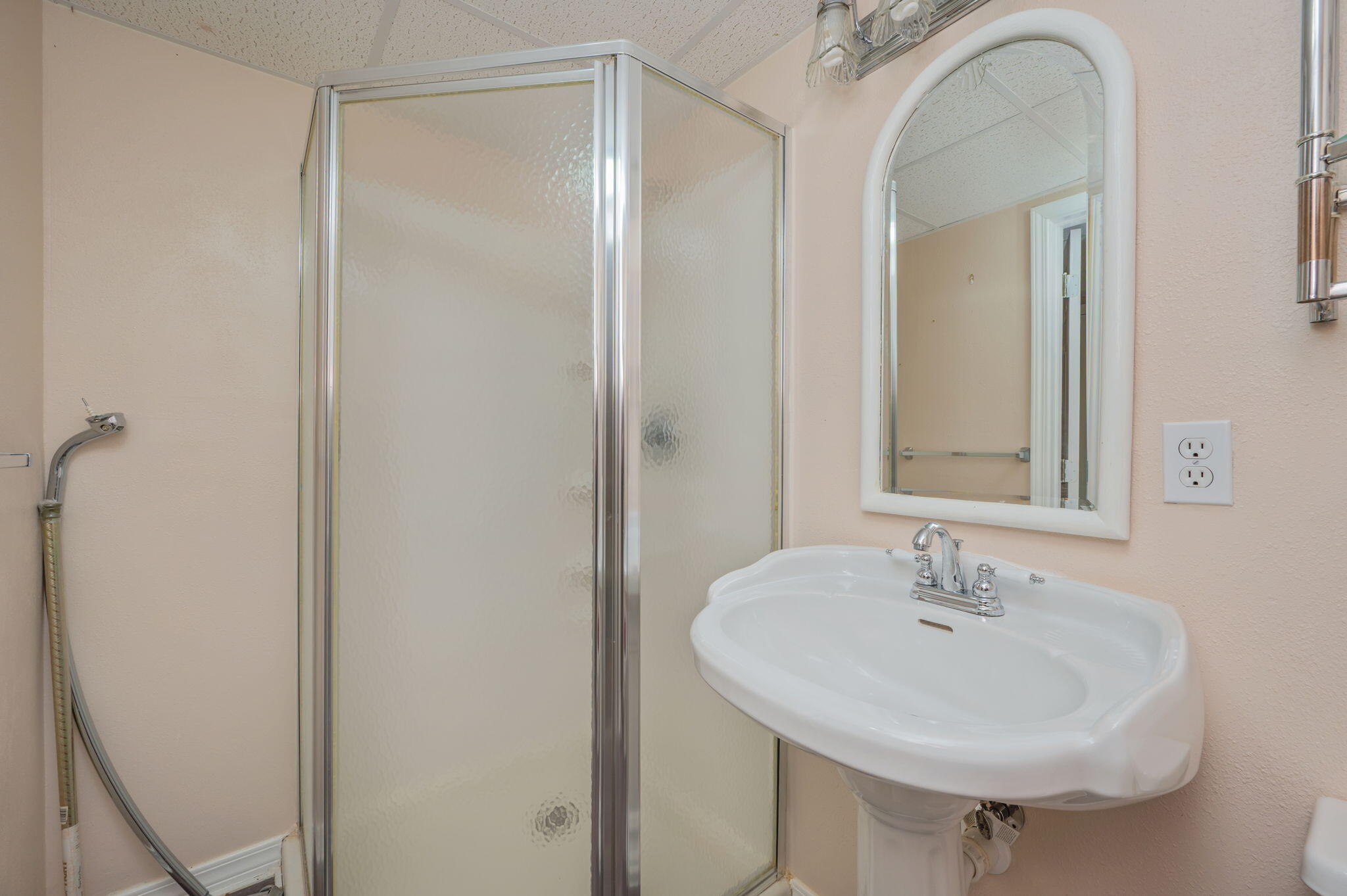 5644 Old Bethel Road Crestview, FL 32536 - Photo 39 of 54 a bathroom with a sink a mirror and a shower