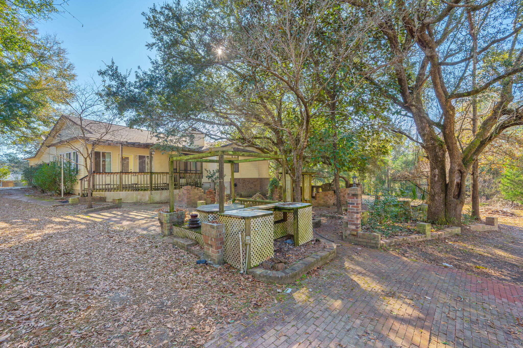 5644 Old Bethel Road Crestview, FL 32536 - Photo 47 of 55 a view of a patio with a chairs and table in the backyard