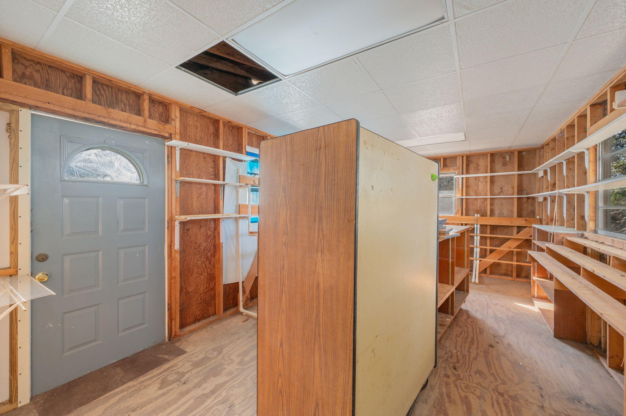 5644 Old Bethel Road Crestview, FL 32536 - Photo 52 of 54 a view of entryway with wooden floor and cabinets