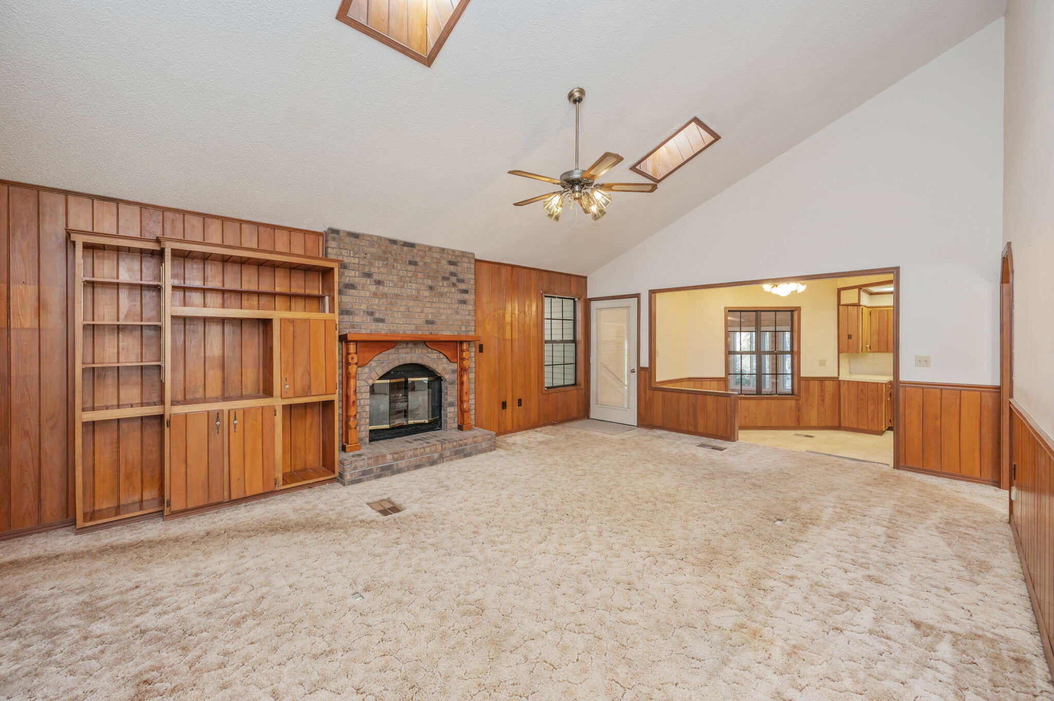 5644 Old Bethel Road Crestview, FL 32536 - Photo 7 of 55 a view of an empty room with a fireplace and cabinet