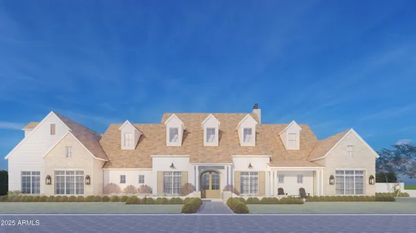 a front view of house with yard and outdoor seating