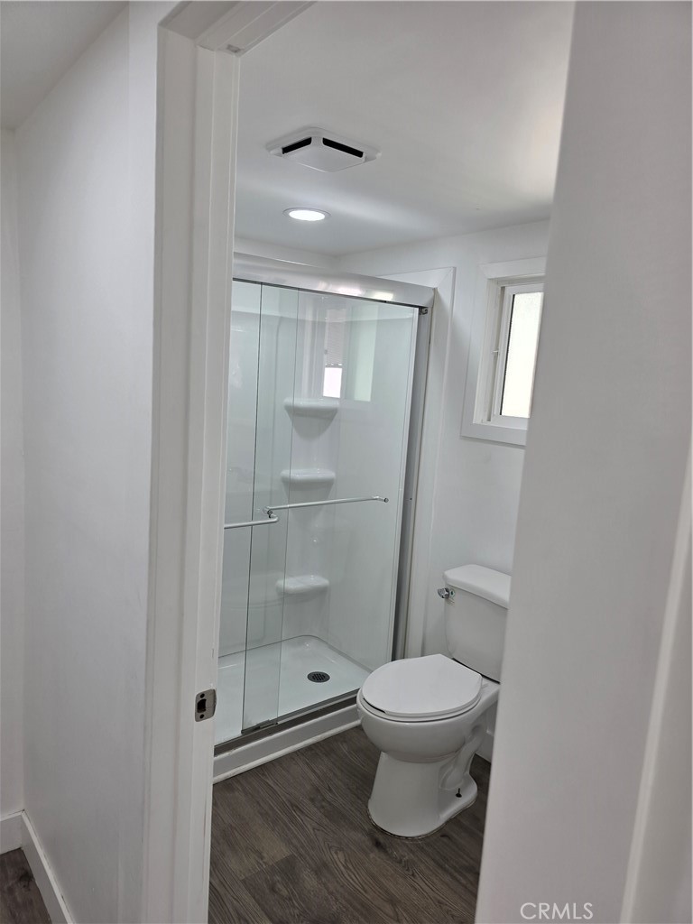 12401 Filmore Street, Unit 637 Sylmar, CA 91342 - Photo 8 of 14 a bathroom with a toilet and a shower