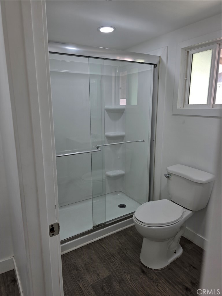 12401 Filmore Street, Unit 637 Sylmar, CA 91342 - Photo 9 of 14 a bathroom with a toilet and a shower