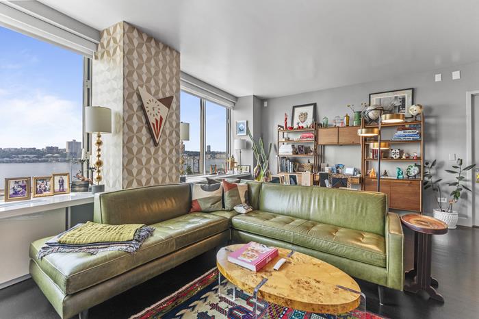 200 Riverside Boulevard, Unit 5L Manhattan, NY 10069 - Photo 2 of 13 a living room with furniture and a large window