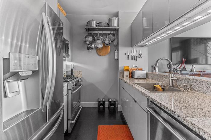 200 Riverside Boulevard, Unit 5L Manhattan, NY 10069 - Photo 4 of 13 a kitchen with a sink stove and refrigerator