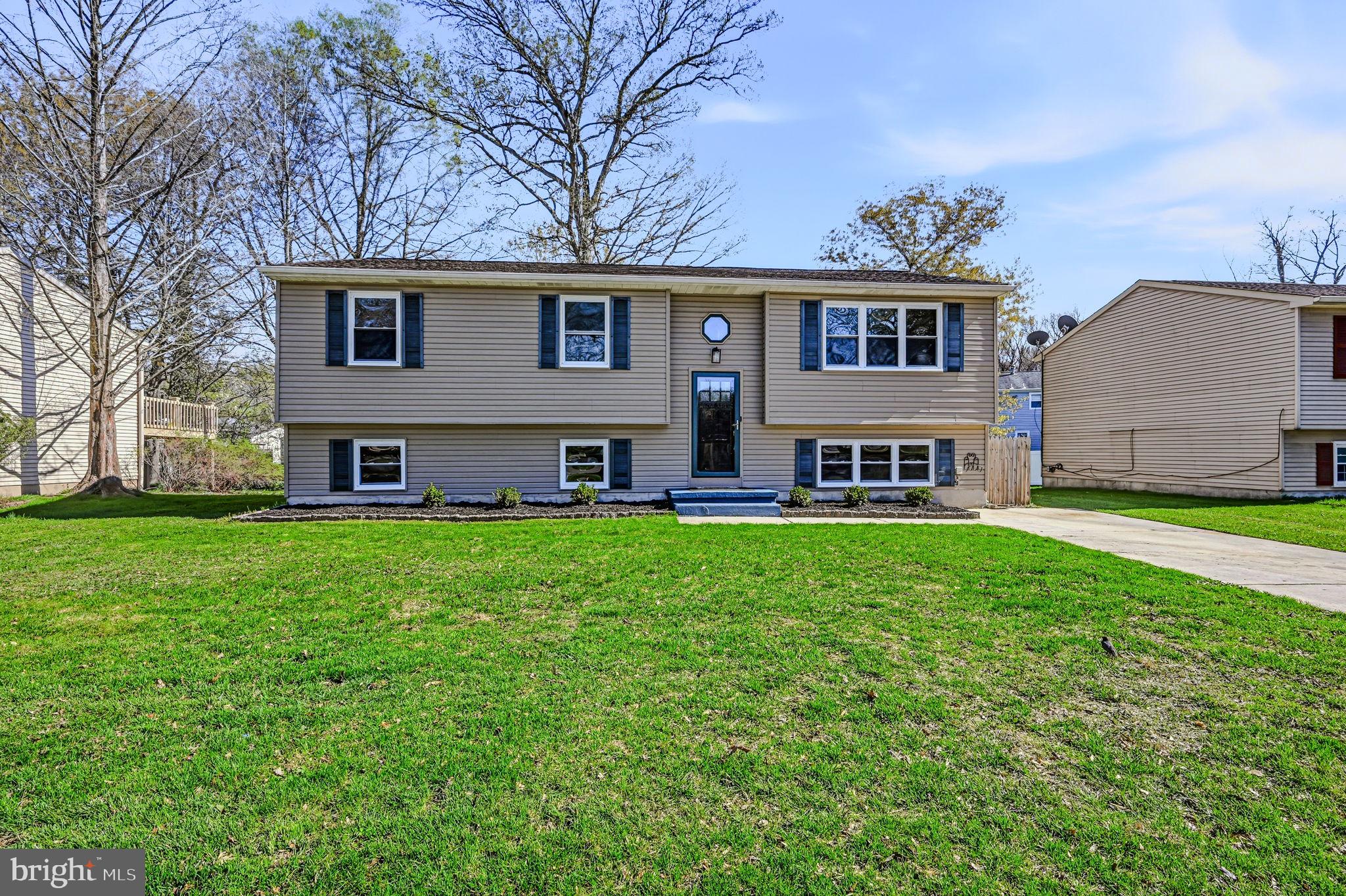 front view of a house with a yard