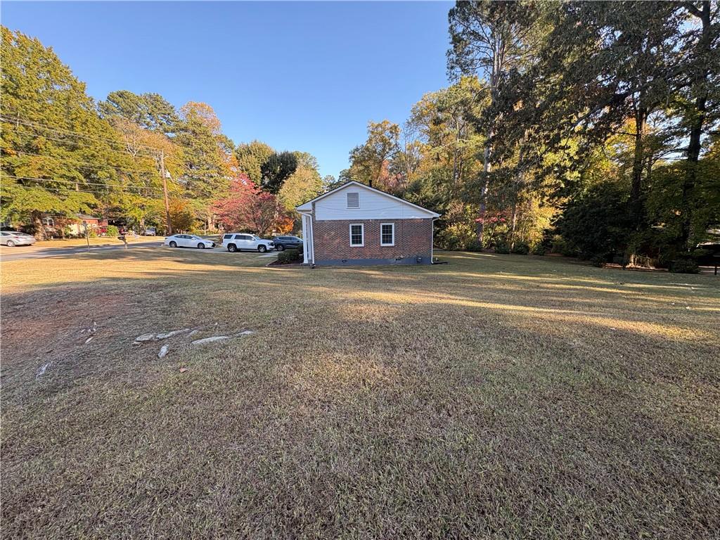 2805 Homeland Drive Atlanta, GA 30360 - Photo 38 of 74 a front view of a house with a yard and garage