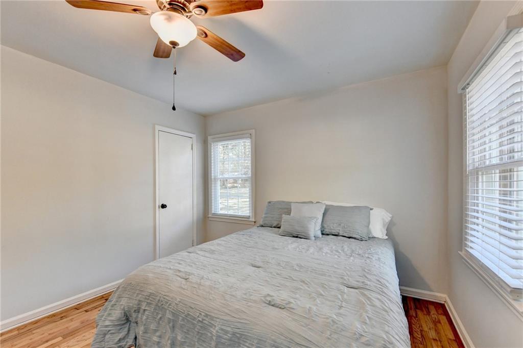 2805 Homeland Drive Atlanta, GA 30360 - Photo 65 of 74 a bedroom with a bed and a chandelier