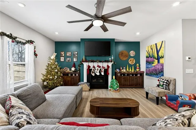 a living room with furniture and a flat screen tv