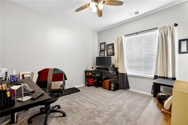 a bedroom with bed and a window