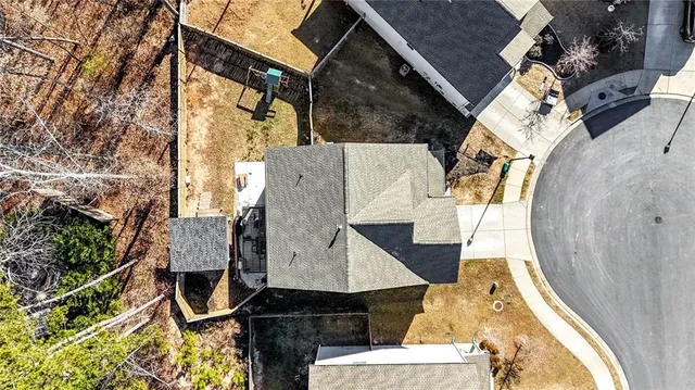 an aerial view of houses with outdoor space