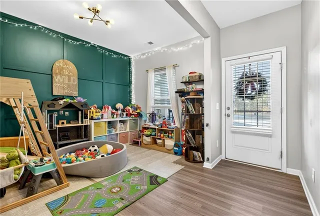 a room with gym equipment and a window