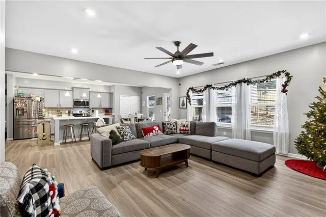 a living room with furniture and a large window