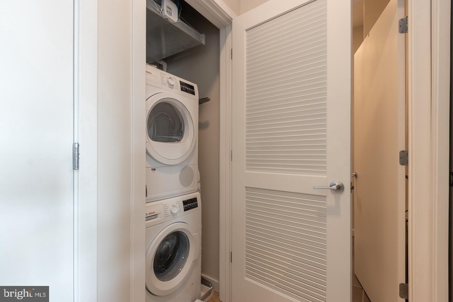 18 West Girard Avenue, Unit 3 Philadelphia, PA 19123 - Photo 11 of 17 a utility room with dryer and washer