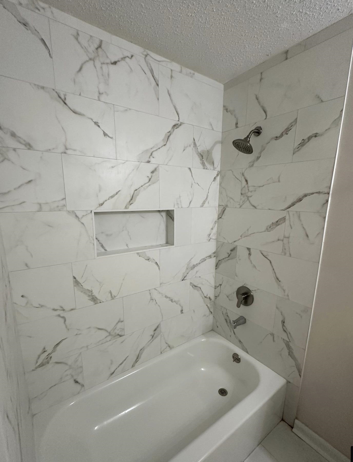 3865 Elliston Road Memphis, TN 38111 - Photo 8 of 11 a bathroom with a bathtub