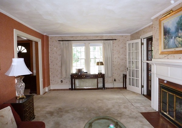 133 Manchester Terrace Springfield, MA 01108 - Photo 4 of 17 a living room with furniture and a fireplace